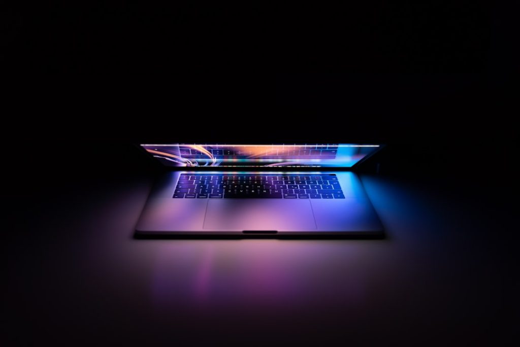 macbook-pro-turned-on-on-white-surface-dufkxrwgqm8
